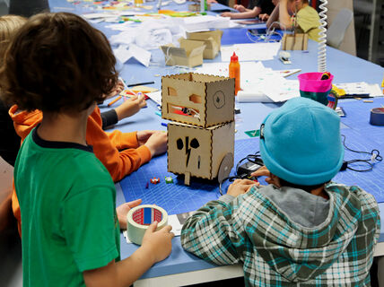 children in robotics workshop