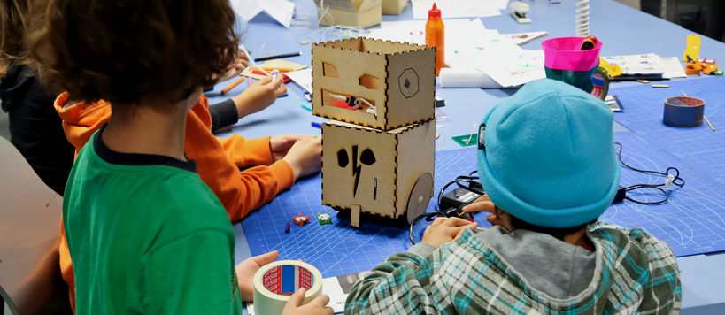 children in robotics workshop